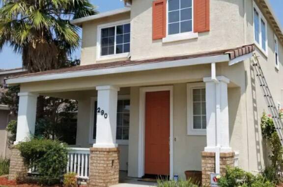 home with eggshell paint, burnt orange and white accents