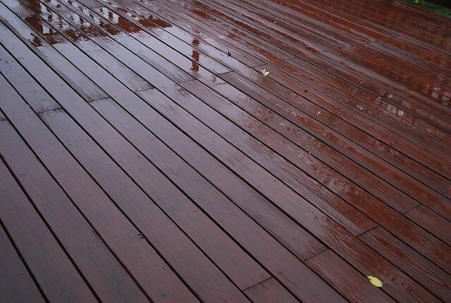 wooden deck with dark red stain