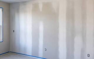 dealing with uneven paint absorption on new drywall