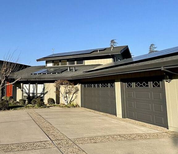 Antioch house painting project with beige walls and dark, warm grey garage doors