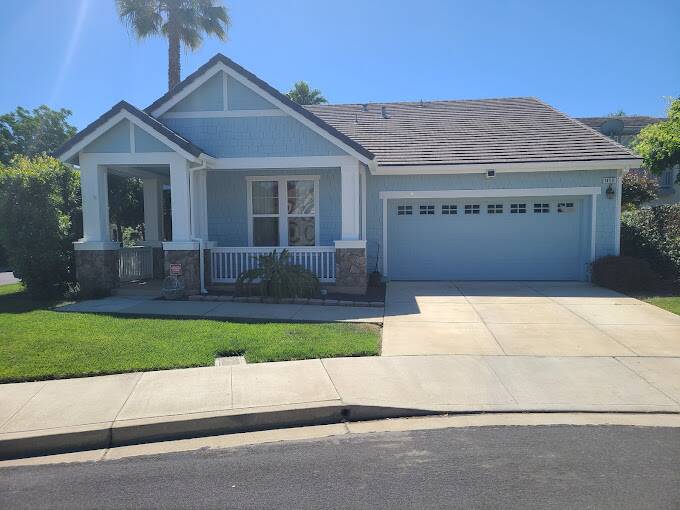 House in Martinez with robin's egg blue paint and white trim.