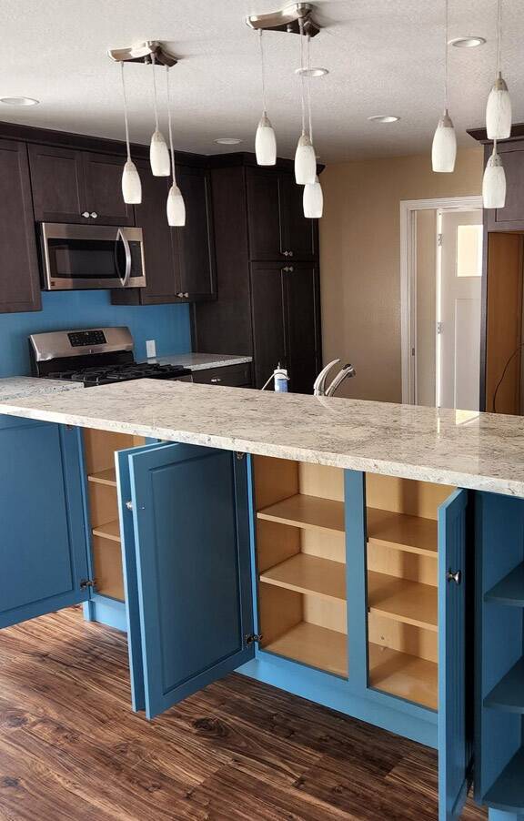 blue kitchen cabinets after refinishing