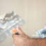 the right way to seal nail pops before repainting interior walls